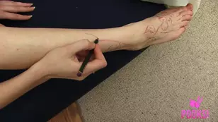 The beautiful blonde girl Amy Days has fun painting hearts on her pie