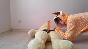 A fetishev's dream with a full size woman in a deer onesie and a toy dildo