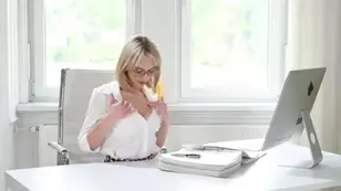 A secretary girl in stockings is having her holes torn by her boss