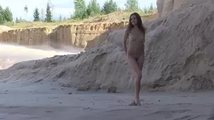 A guy is admiring his body naked in the nature