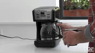 A fine matte haired brunette girl is getting fucked at her workplace in doggy style